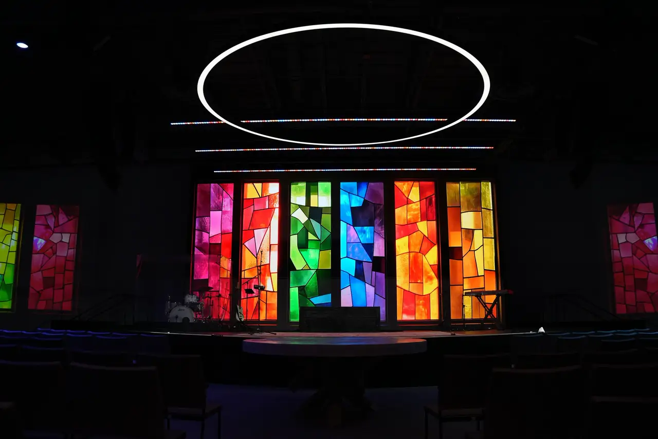 City Church worship center stage with a multicolor LED wall and a white ring light overhead