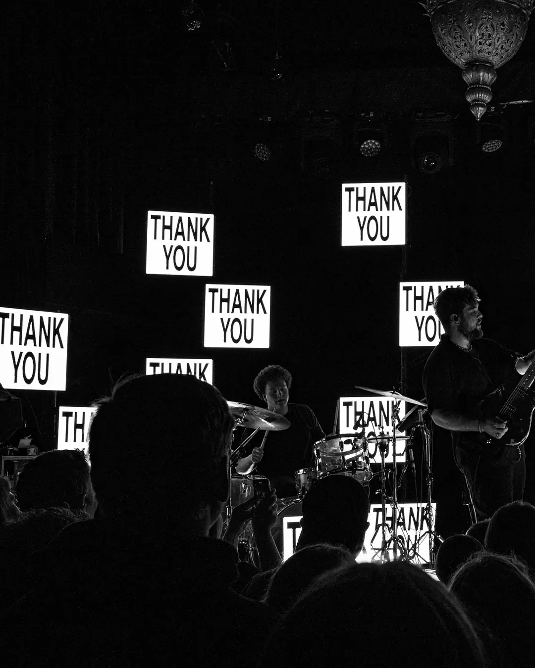 Every LED panel reading THANK YOU above the band, crowd in silhouette